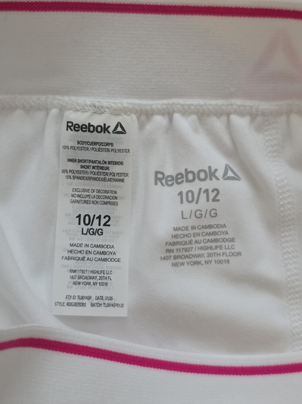Reebok white tennis skirt features a classic pleated design with a pink accent - Picture 7 of 8